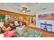 Cozy living room featuring warm wood paneling, comfortable leather seating, and an inviting open layout at 1500 Robinson N Dr, St Petersburg, FL 33710