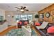 Well-lit living room featuring comfortable seating, a stylish rug, and inviting decor at 1500 Robinson N Dr, St Petersburg, FL 33710