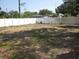 Spacious backyard with a white privacy fence and room to add your personal touch at 162 Sw Lincoln N Cir, St Petersburg, FL 33703