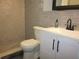 Updated bathroom featuring a modern vanity, toilet and a tiled shower area at 162 Sw Lincoln N Cir, St Petersburg, FL 33703