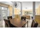 Open-concept dining area leading to the living room, featuring stylish decor and abundant natural light at 1768 Lago Vista Blvd, Palm Harbor, FL 34685
