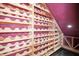 Unique wine cellar with custom wooden racks, accent lighting, and ample space for storing a vast collection at 1768 Lago Vista Blvd, Palm Harbor, FL 34685