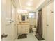 The bathroom features a shower, toilet, single sink vanity, and mirrored medicine cabinet at 1829 1St E Ave, Bradenton, FL 34208