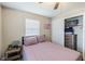 Comfortable bedroom featuring a closet for storage and a large window with blinds at 1829 1St E Ave, Bradenton, FL 34208