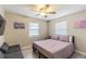 Cozy bedroom with a seating area and a large window that lets in natural light at 1829 1St E Ave, Bradenton, FL 34208