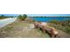 Scenic park view with paved path and bench seating beside a tranquil body of water at 1829 1St E Ave, Bradenton, FL 34208