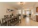 Dining area adjacent to open concept kitchen featuring a large dining table at 1829 1St E Ave, Bradenton, FL 34208