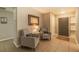 Inviting entryway with tiled floor, chairs, and decorative mirror at 1829 1St E Ave, Bradenton, FL 34208