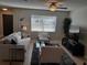 Bright living room with tile floors, light gray walls, and large windows at 1829 1St E Ave, Bradenton, FL 34208