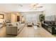 Neutral living room with tile floors, comfortable seating, and lots of natural light at 1829 1St E Ave, Bradenton, FL 34208