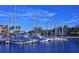 Picturesque marina view with sailboats docked in calm water under a clear blue sky, surrounded by lush greenery at 1829 1St E Ave, Bradenton, FL 34208