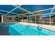 Enclosed pool with a clear blue water at 1829 1St E Ave, Bradenton, FL 34208