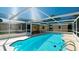 This gorgeous pool has a screened enclosure and clear, blue water at 1829 1St E Ave, Bradenton, FL 34208