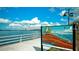 Scenic waterfront view with artwork featuring local wildlife, a railing, and a view of the water and bridge at 1829 1St E Ave, Bradenton, FL 34208