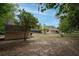 Spacious backyard boasts a shed and a screened enclosure, ideal for outdoor activities at 18546 Kelly Rd, Spring Hill, FL 34610