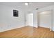 Bedroom with wood floors, bright walls, closet, and ceiling fan at 18546 Kelly Rd, Spring Hill, FL 34610