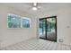 Bedroom with access to the pool, ceiling fan, and ample natural light at 18546 Kelly Rd, Spring Hill, FL 34610