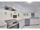 Kitchen featuring granite counters, and stainless steel appliances open to additional living space at 18546 Kelly Rd, Spring Hill, FL 34610