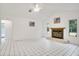 Bright living area with vaulted ceiling, fireplace, and tile floors at 18546 Kelly Rd, Spring Hill, FL 34610