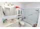 Bathroom featuring a tile shower, modern sink, storage, and updated fixtures at 1900 58Th N Ave # 26, St Petersburg, FL 33714