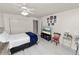Comfortable bedroom with white ceiling fan, ample closet space, and neutral decor at 1900 58Th N Ave # 26, St Petersburg, FL 33714