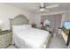 Well-lit bedroom features a vanity area, plush bedding, and modern amenities at 1900 58Th N Ave # 26, St Petersburg, FL 33714
