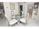 Bright dining area features a glass-top table with seating for four and stylish decor at 1900 58Th N Ave # 26, St Petersburg, FL 33714