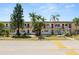 Exterior of home with stairs, mature trees, and well maintained grounds at 1900 58Th N Ave # 26, St Petersburg, FL 33714