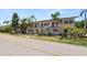 Exterior of property with updated doors and palm trees at 1900 58Th N Ave # 26, St Petersburg, FL 33714