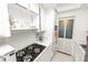 Efficient white kitchen with modern appliances, light walls, and tiled floor at 1900 58Th N Ave # 26, St Petersburg, FL 33714