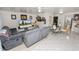 Bright living room features neutral colors, updated flooring, ceiling fan and furniture at 1900 58Th N Ave # 26, St Petersburg, FL 33714