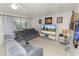 Cozy living room with light colored walls, comfortable seating, and natural light at 1900 58Th N Ave # 26, St Petersburg, FL 33714