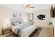 Relaxing bedroom with calm colors, ceiling fan, cozy linens, an area rug, and plenty of natural light at 1981 Lakewood Club S Dr # 4M, St Petersburg, FL 33712