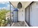 Enclosed patio with sliding glass doors and garden views, ready for relaxation at 1981 Lakewood Club S Dr # 4M, St Petersburg, FL 33712
