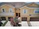 Aerial view of the townhomes shows well-kept lawns and a shared entryway at 1984 Hawks View Dr, Ruskin, FL 33570