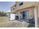 Backyard patio with grill and sliding glass door to interior at 1984 Hawks View Dr, Ruskin, FL 33570