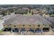 View of townhome backyard, which includes a patio at 1984 Hawks View Dr, Ruskin, FL 33570