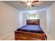 Traditional bedroom with a wooden bed frame and ceiling fan at 1984 Hawks View Dr, Ruskin, FL 33570