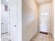 View of the entryway with tiled floors and a white front door with glass panels at 1984 Hawks View Dr, Ruskin, FL 33570