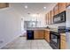 View of the kitchen area leading to a dining and living area at 1984 Hawks View Dr, Ruskin, FL 33570