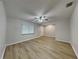 Bright, airy bedroom featuring modern wood floors, ceiling fan and a window that provides natural light at 2105 Oakview Ln, Plant City, FL 33566