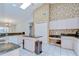 Bright kitchen featuring granite countertops, white cabinets, and an eat-in island with extra counter space at 2117 Laindale Pl, Valrico, FL 33596