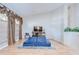Cozy living room with hardwood floors, a comfortable seating area, and a large window at 2117 Laindale Pl, Valrico, FL 33596