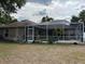 Large screened-in enclosure featuring a swimming pool, creating the ultimate outdoor oasis at 2213 Towering Oaks Cir, Seffner, FL 33584