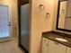 Bathroom featuring walk-in shower and granite countertop vanity at 2213 Towering Oaks Cir, Seffner, FL 33584