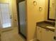 Bathroom featuring a glass shower, vanity with granite countertop, and tile floors at 2213 Towering Oaks Cir, Seffner, FL 33584