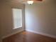 Bedroom with laminate flooring, a ceiling fan, and a window with blinds at 2213 Towering Oaks Cir, Seffner, FL 33584