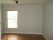 Bedroom with laminate flooring, a ceiling fan, and a window with blinds at 2213 Towering Oaks Cir, Seffner, FL 33584
