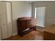 Versatile bedroom offers a dresser with drawers for storage and plenty of natural light at 2213 Towering Oaks Cir, Seffner, FL 33584