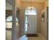 Foyer with tile floors, arched doorways, and a chandelier at 2213 Towering Oaks Cir, Seffner, FL 33584
